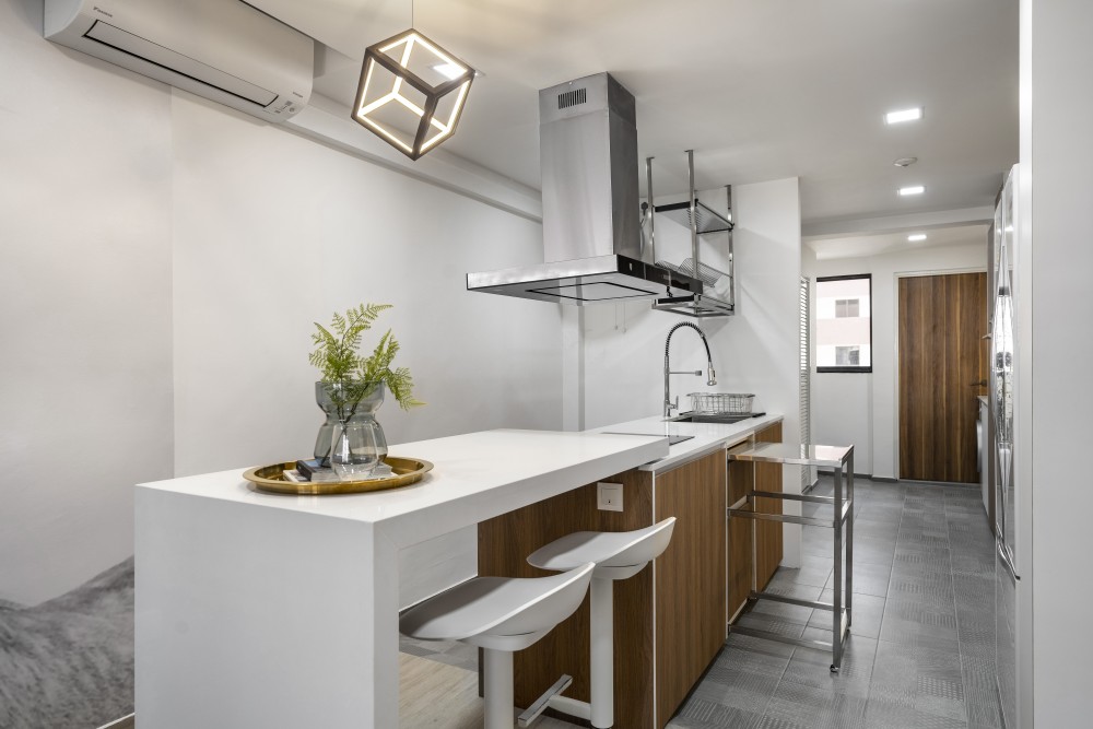 modern kitchen with countertop and homogeneous tiles