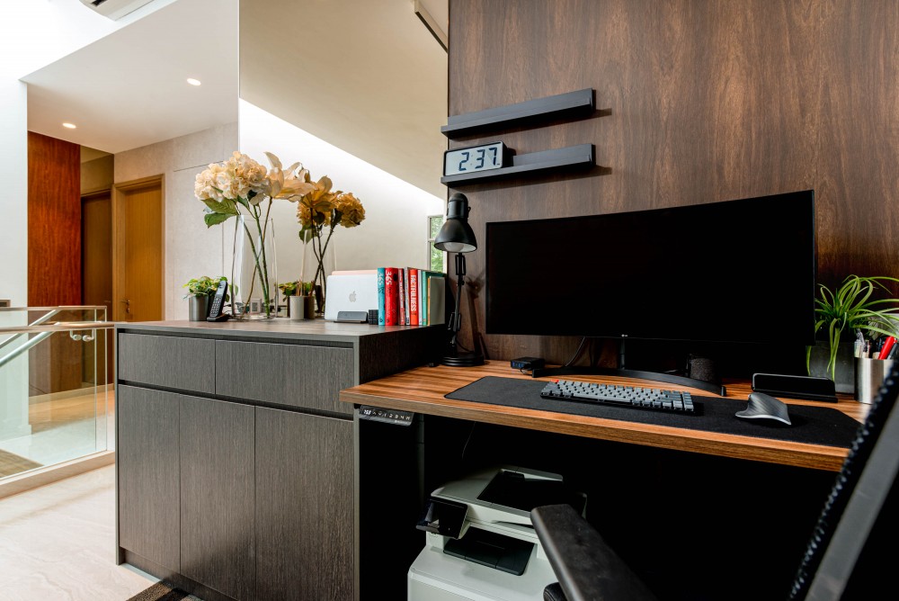 modern study with bookshelf and computer