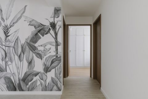 scandinavian hallway with vinyl flooring and artwork