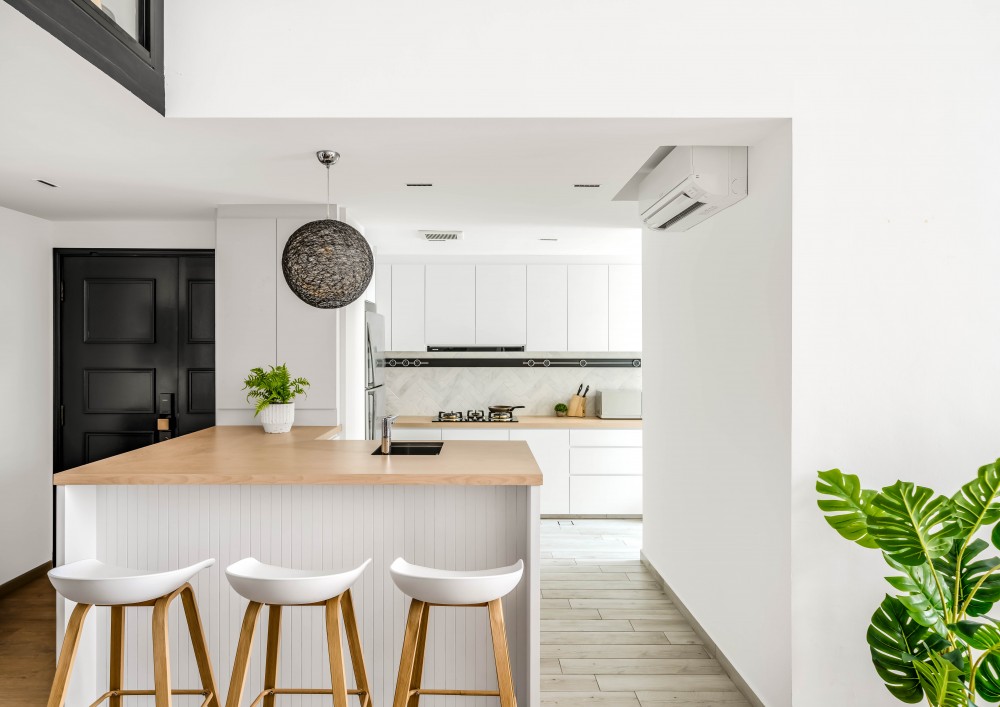 scandinavian kitchen with bar counter and kitchen tap