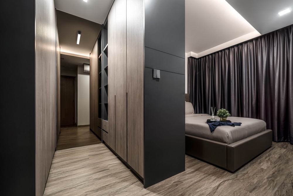 contemporary bedroom with wood flooring and wardrobe
