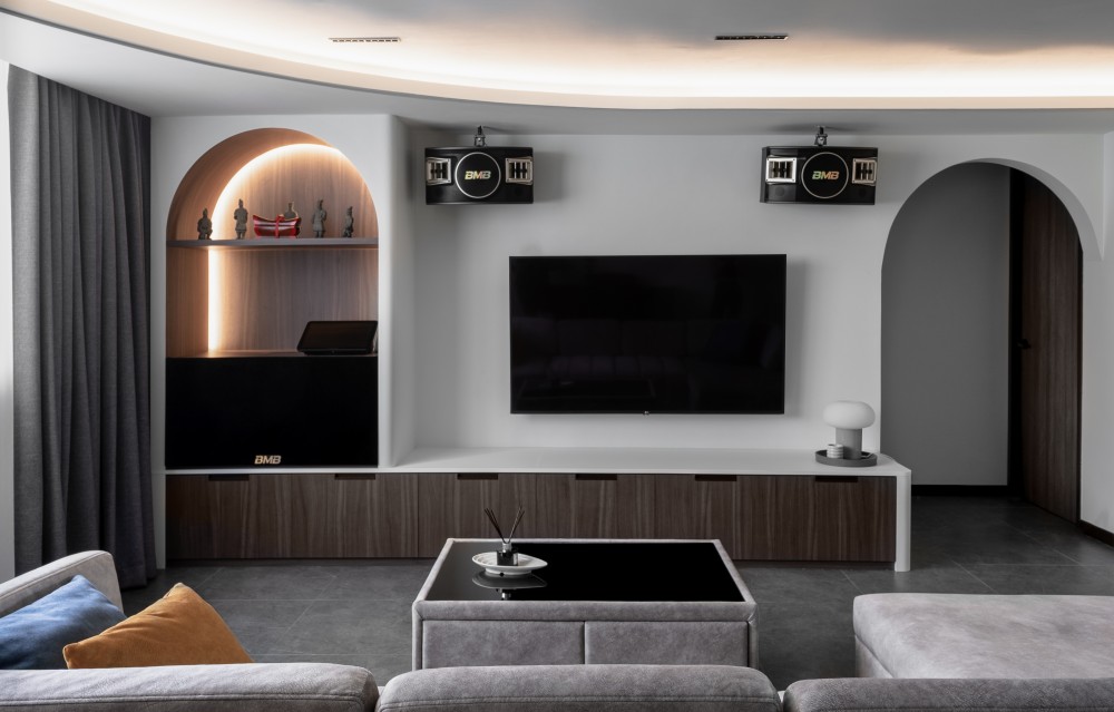contemporary living room with tv console and cove lighting