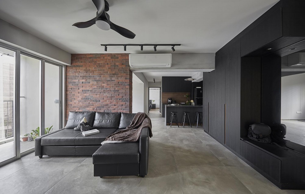 industrial living room with feature wall and ceiling fan