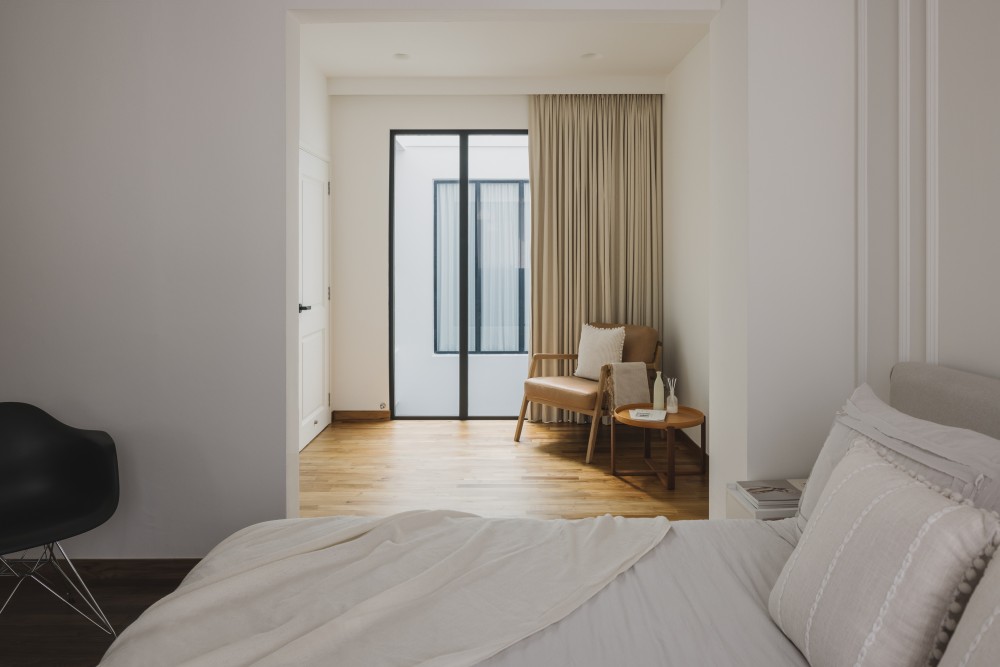 minimalist bedroom with parquet floor and curtain