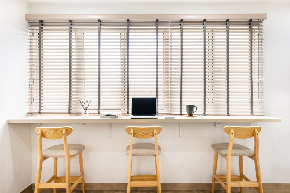 minimalist study with vinyl flooring and window seat