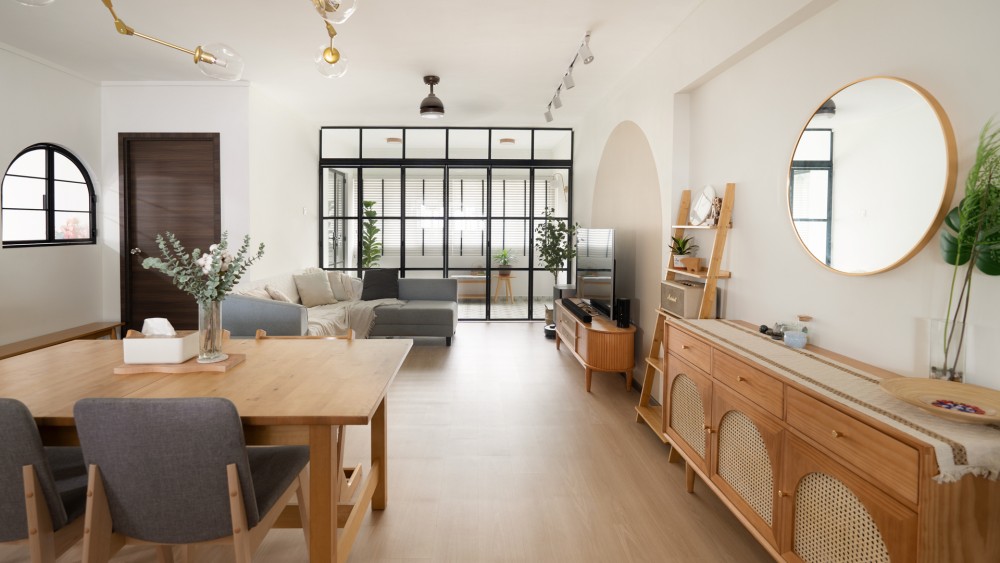 scandinavian living room with bookshelf and settee