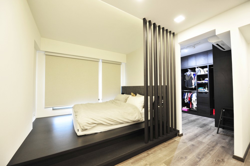 contemporary bedroom with platform bed and downlights