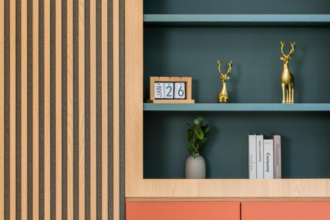 eclectic study with bookshelf and storage cabinets