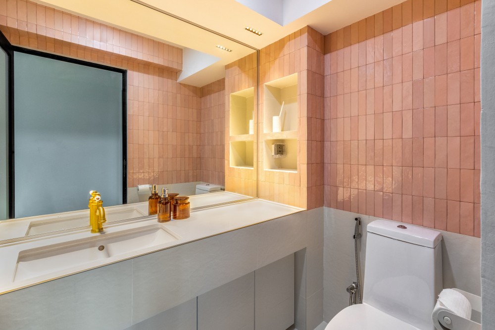 modern bathroom with homogeneous tiles and mirror