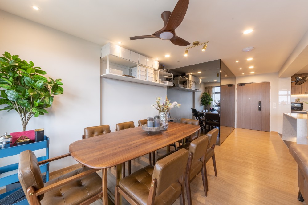 modern dining room with wood flooring and mirror