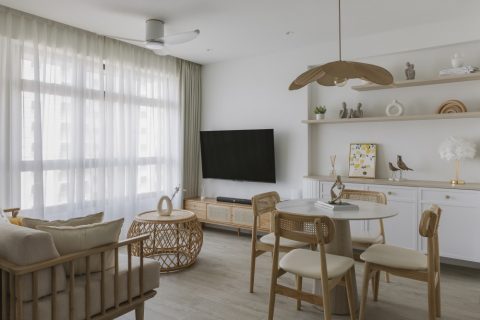 scandinavian living room with tv console and curtain