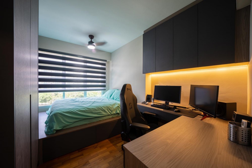 contemporary bedroom with wood flooring and built in bed