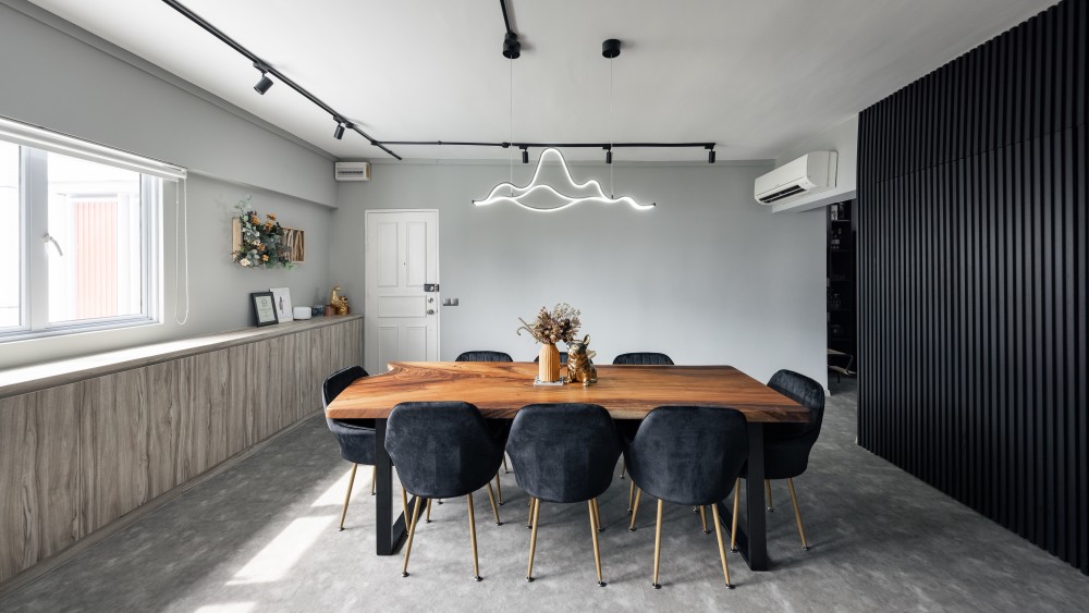 industrial dining room with cement floor and feature wall