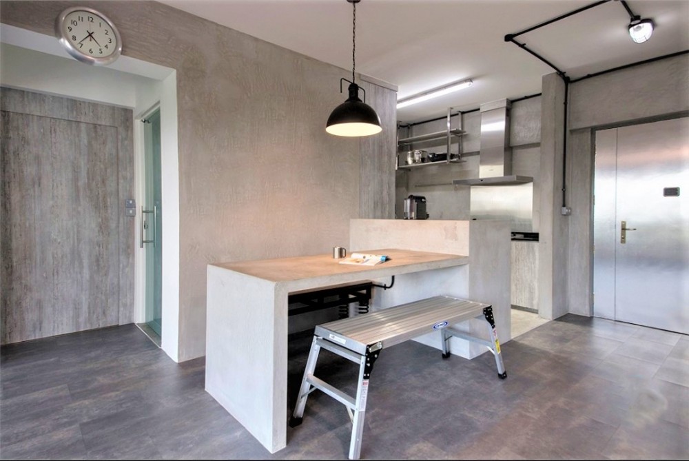 industrial dining room with drop light and open kitchen