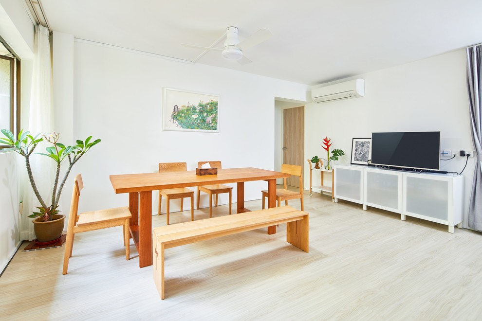 minimalist dining room with drop light and dining table