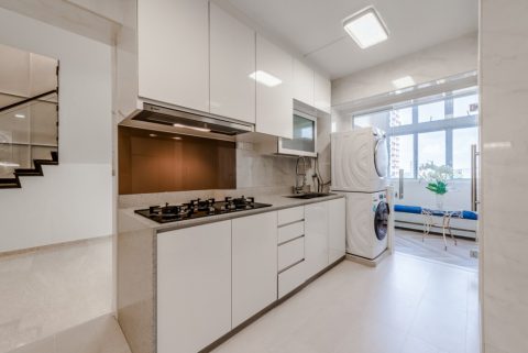 modern kitchen with countertop and homogeneous tiles