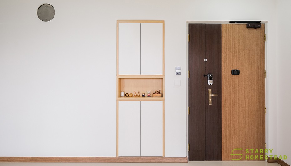 scandinavian entryway with shoe cabinets and doors