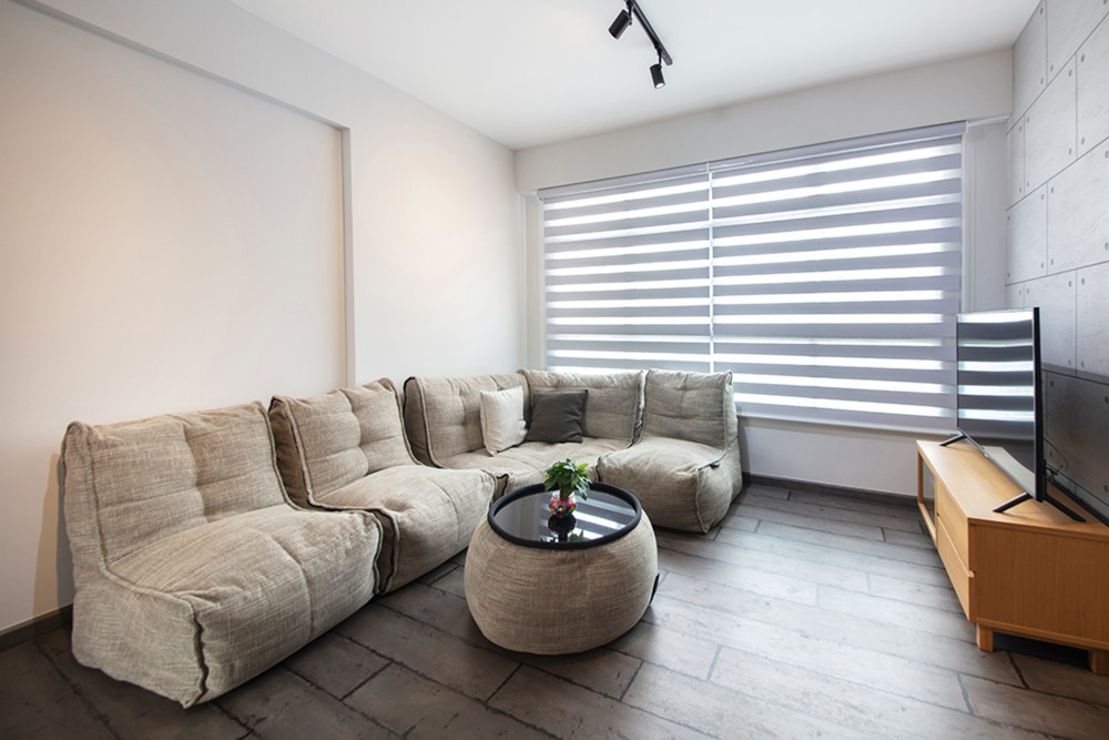 industrial living room with tv console and feature wall