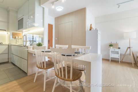 minimalist dining room with drop light and open kitchen