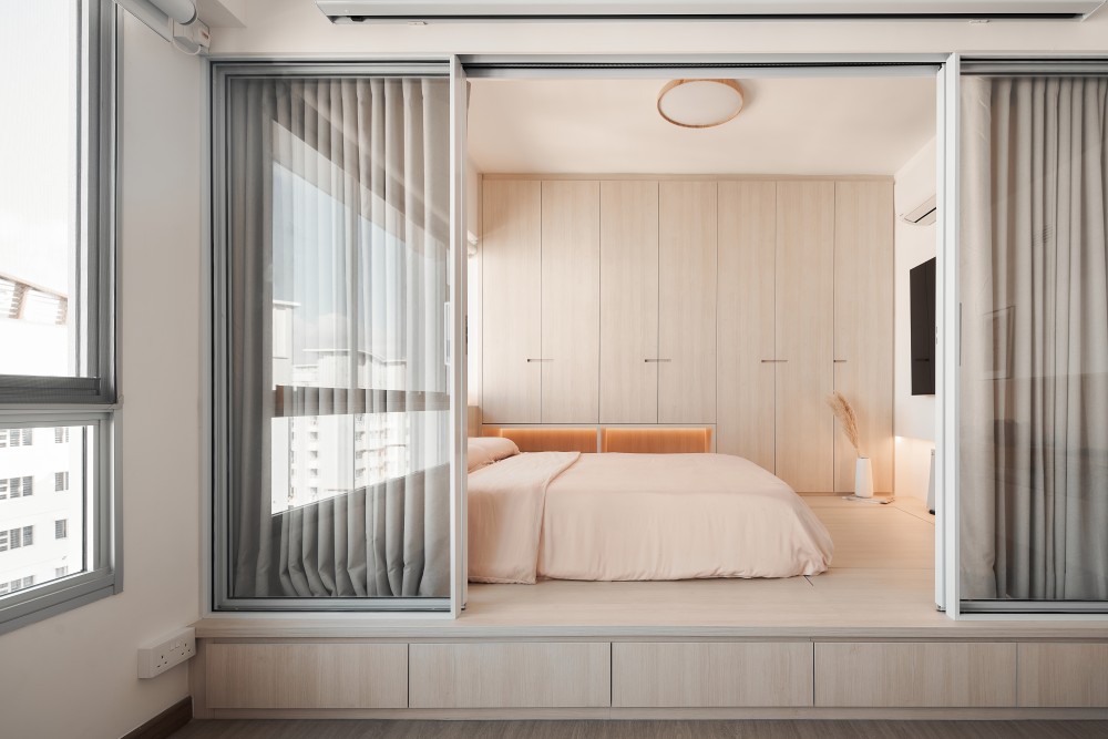 minimalist bedroom with platform bed and storage cabinets