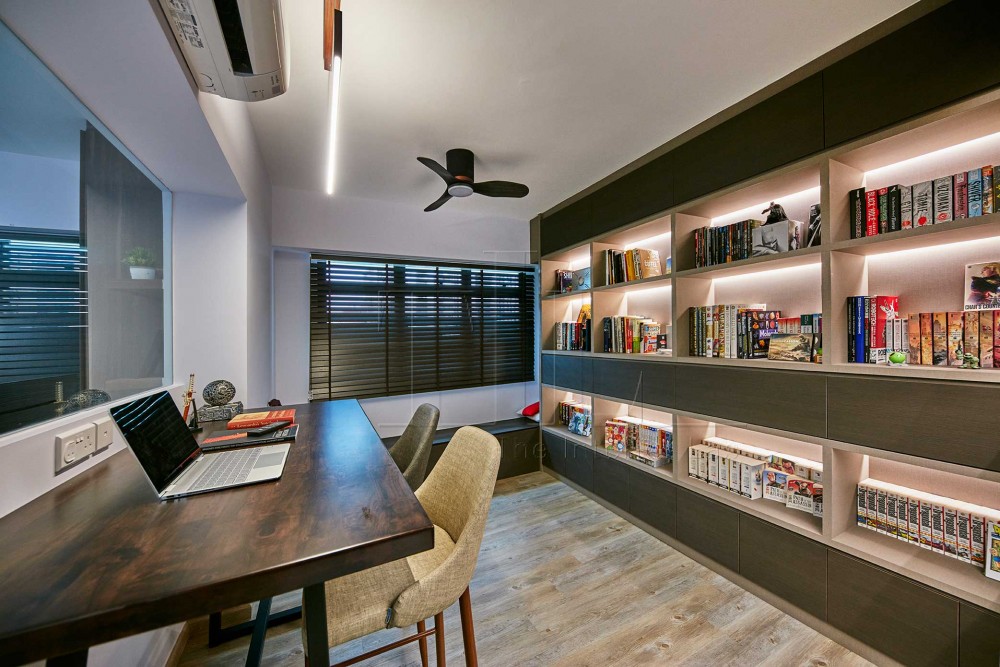 asian home office with bookshelf and cove lighting