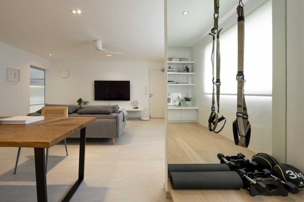 eclectic home gym with mirror and sofa
