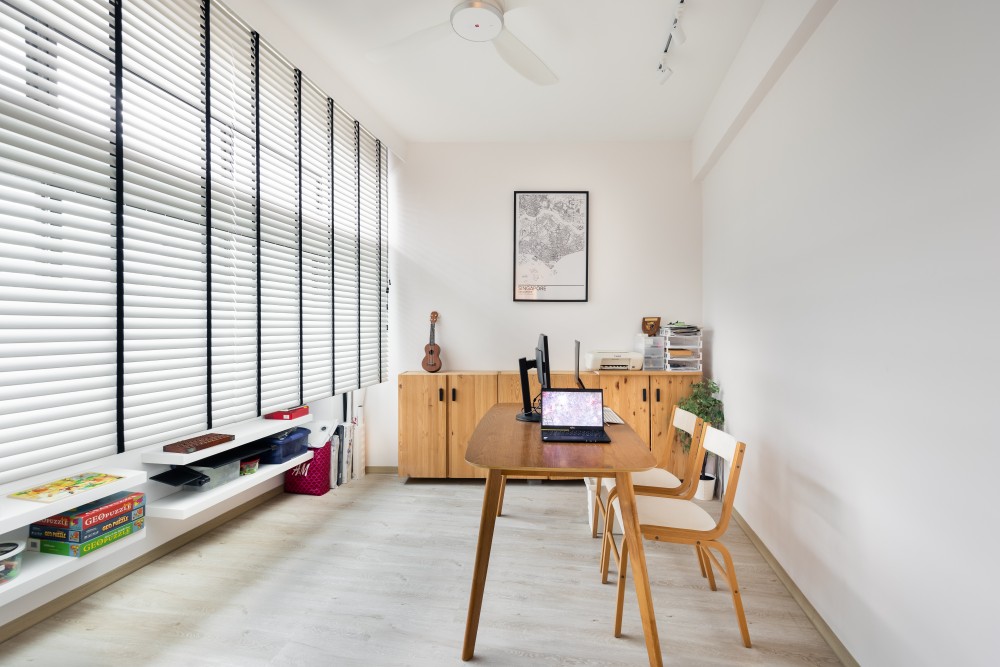 minimalist home office with desk and desk chairs