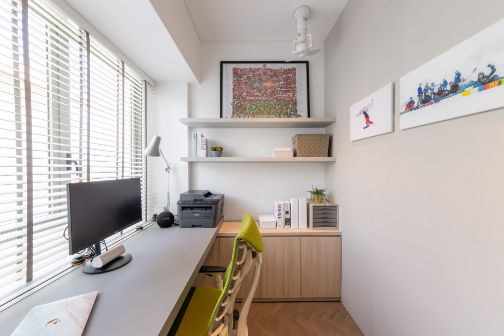 modern study with bookshelf and ceiling fan