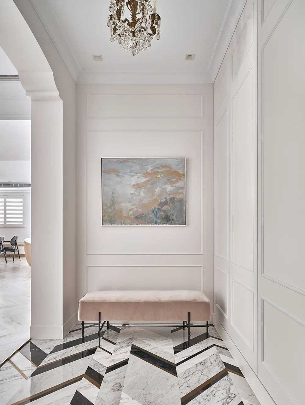 contemporary foyer with herringbone tiling and marble floor