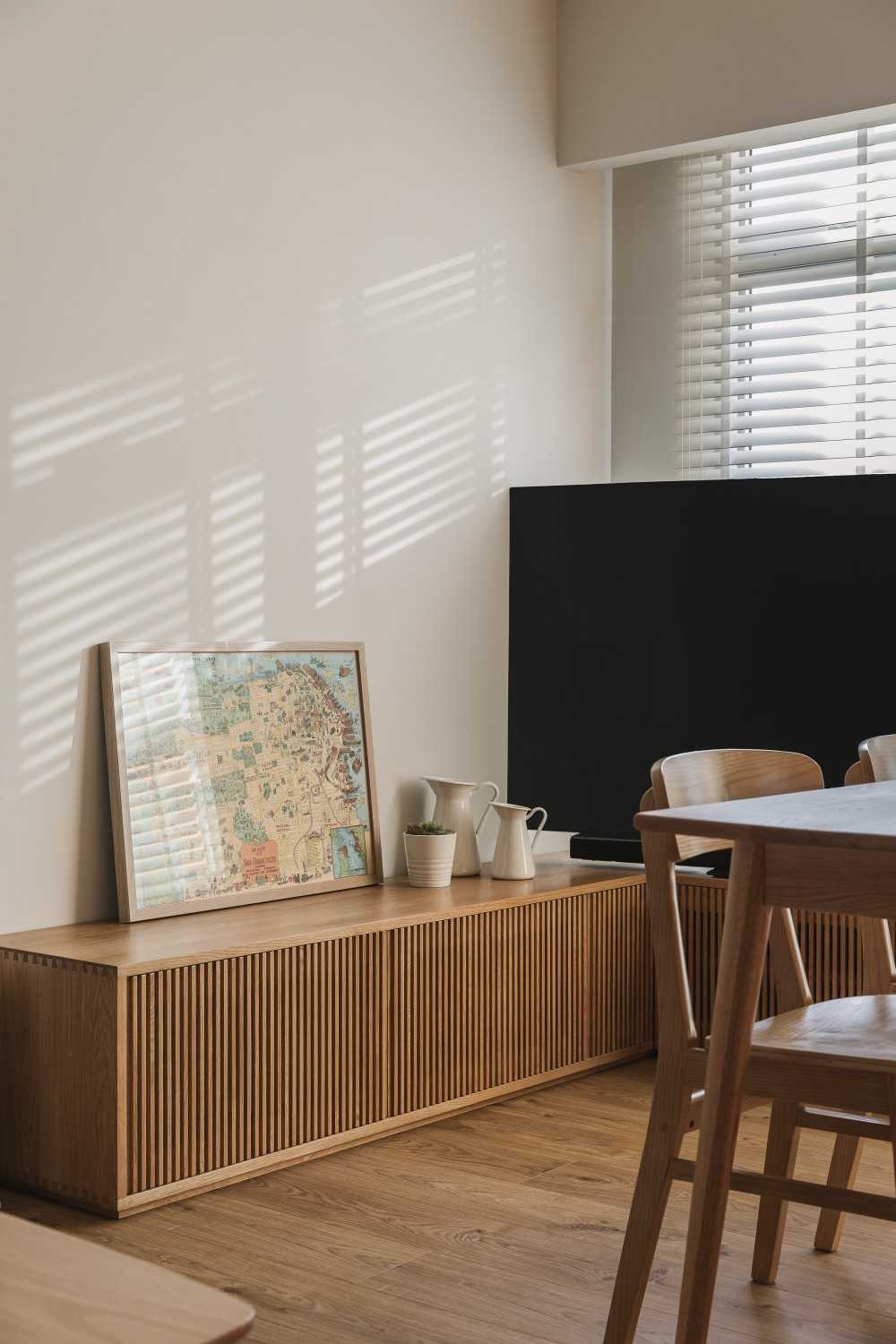 modern living room with wood flooring and tv console