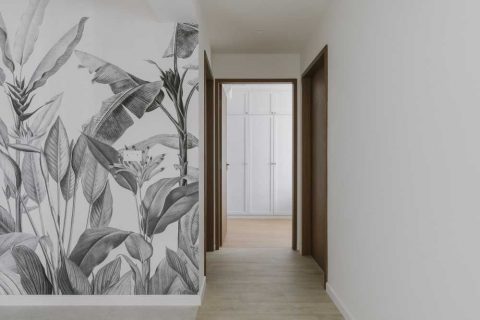 scandinavian hallway with vinyl flooring and artwork