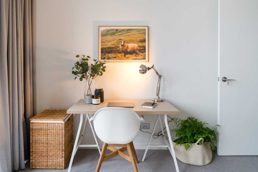 eclectic study with artwork and desk