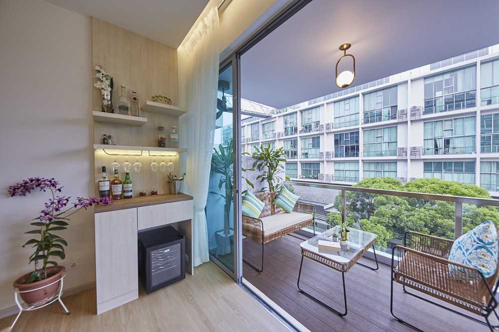 minimalist balcony with wood flooring and window seat