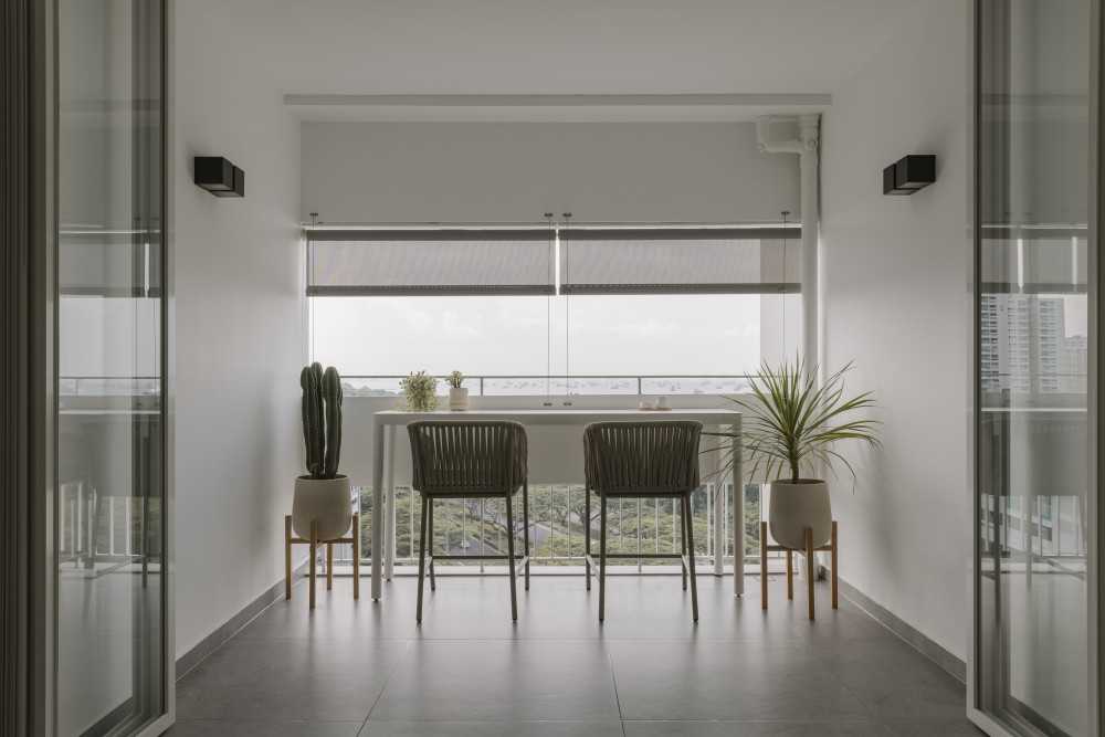 modern balcony with window shutters and outdoor table