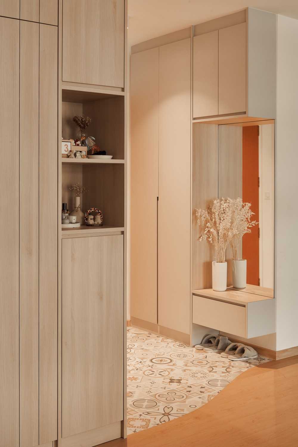 scandinavian entryway with mirror and storage cabinets