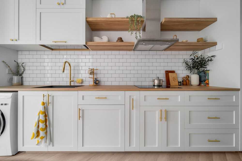 country kitchen with countertop and herringbone tiling