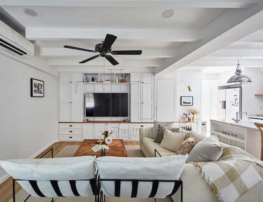 country living room with tv console and ceiling fan