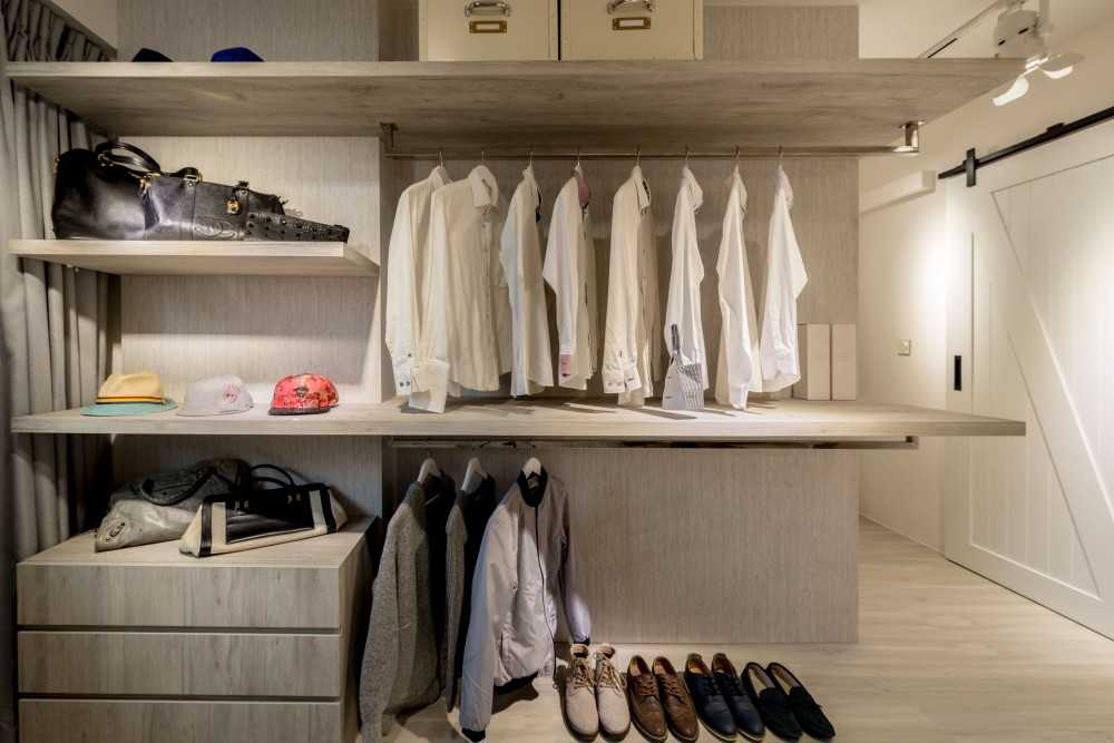 scandinavian walk in wardrobe with mirror and wardrobe