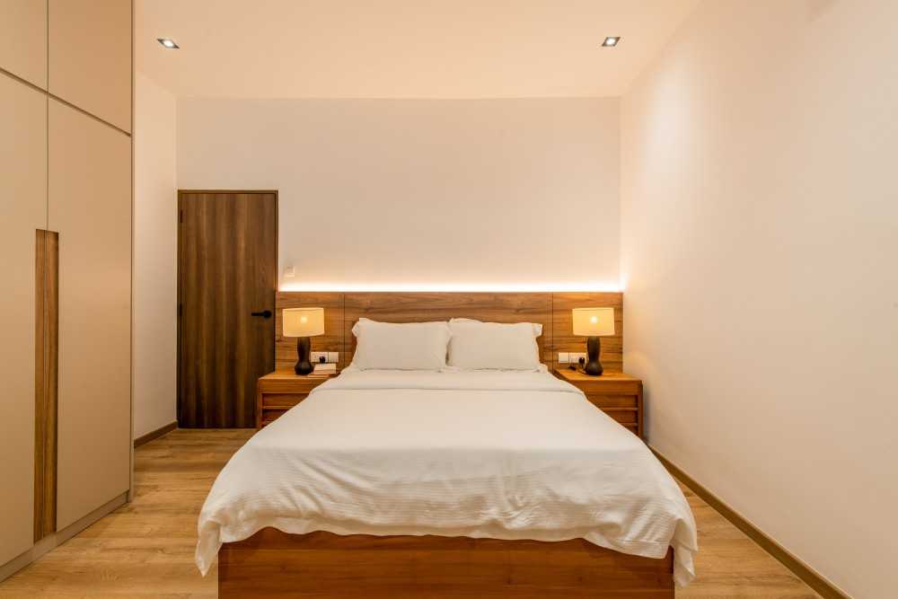 contemporary bedroom with parquet floor and ceiling light