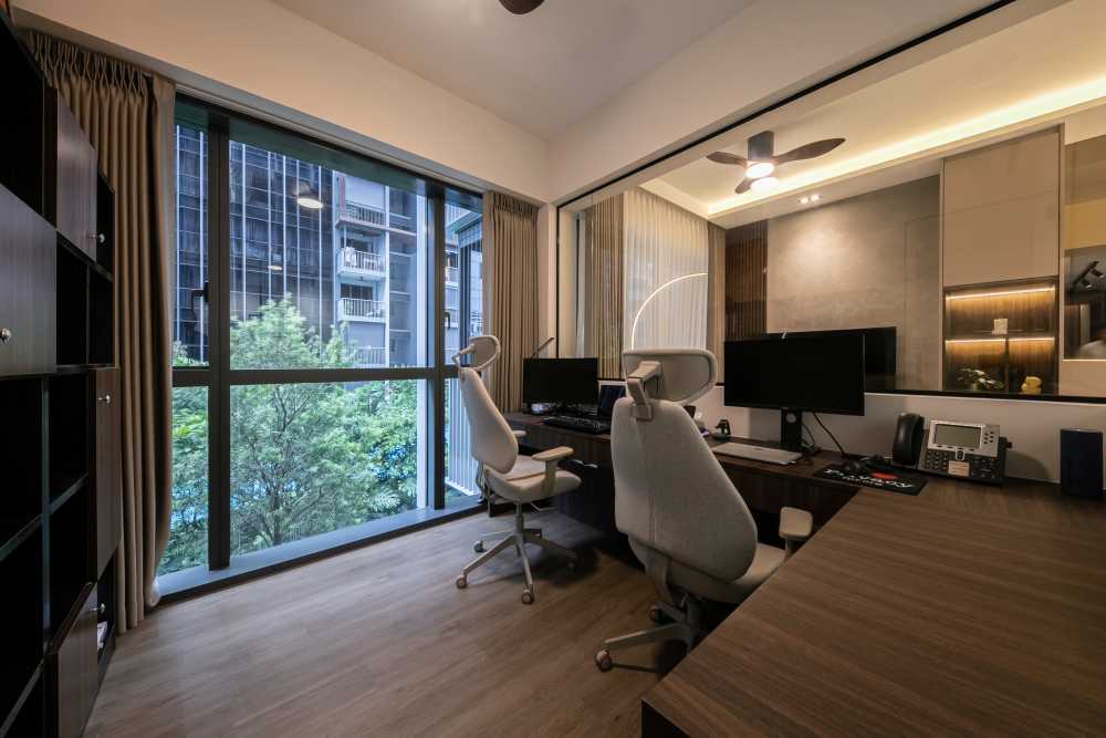 contemporary home office with desk and desk chairs