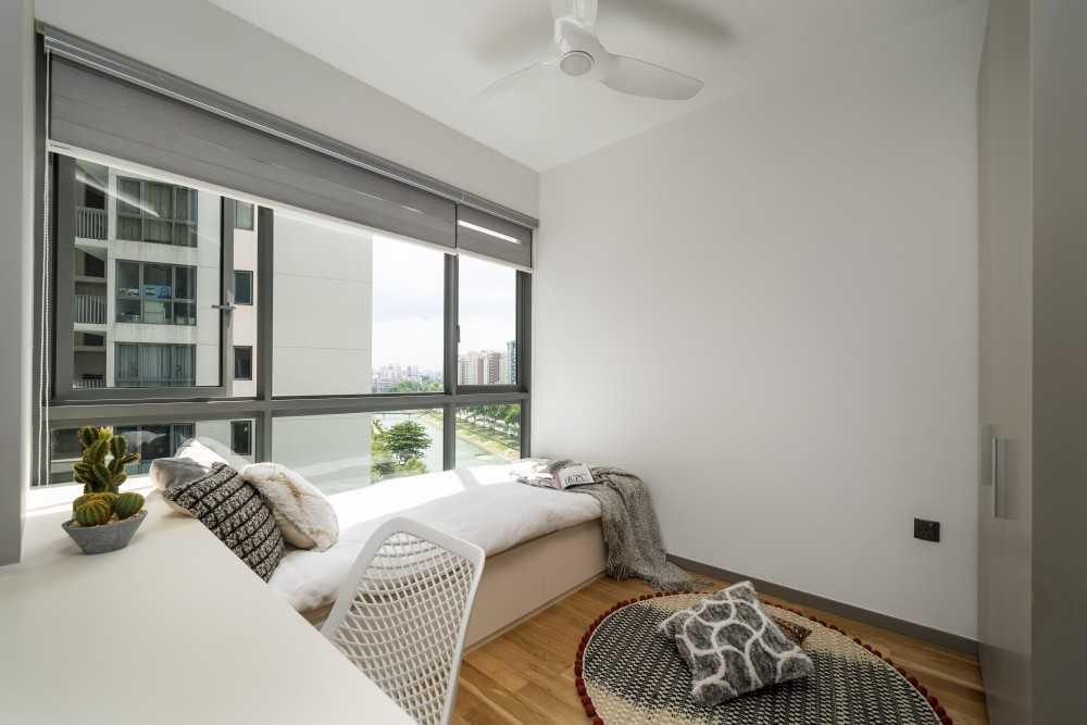 contemporary bedroom with wood flooring and built in bed