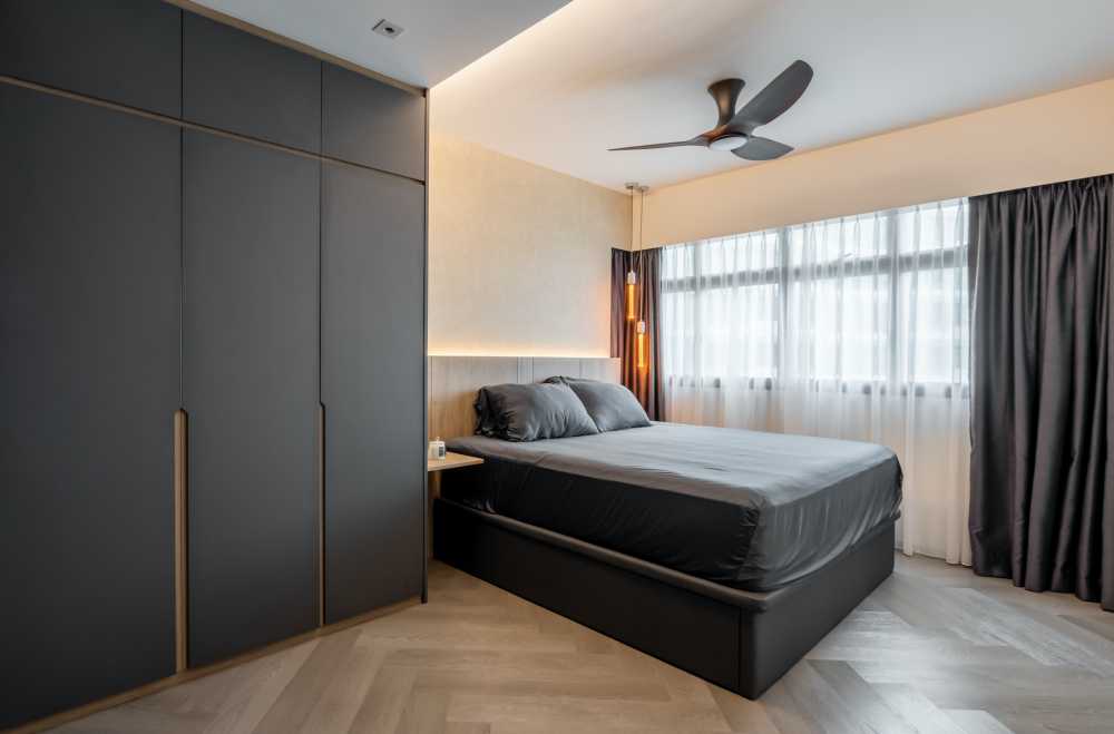 modern bedroom with herringbone tiling and ceiling light
