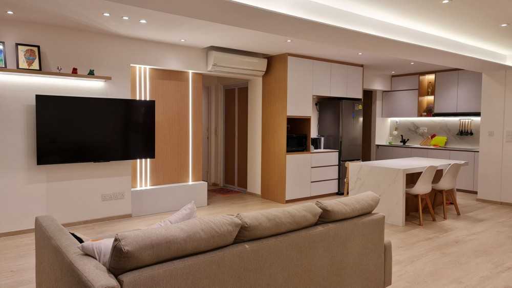 modern living room with feature wall and drop light