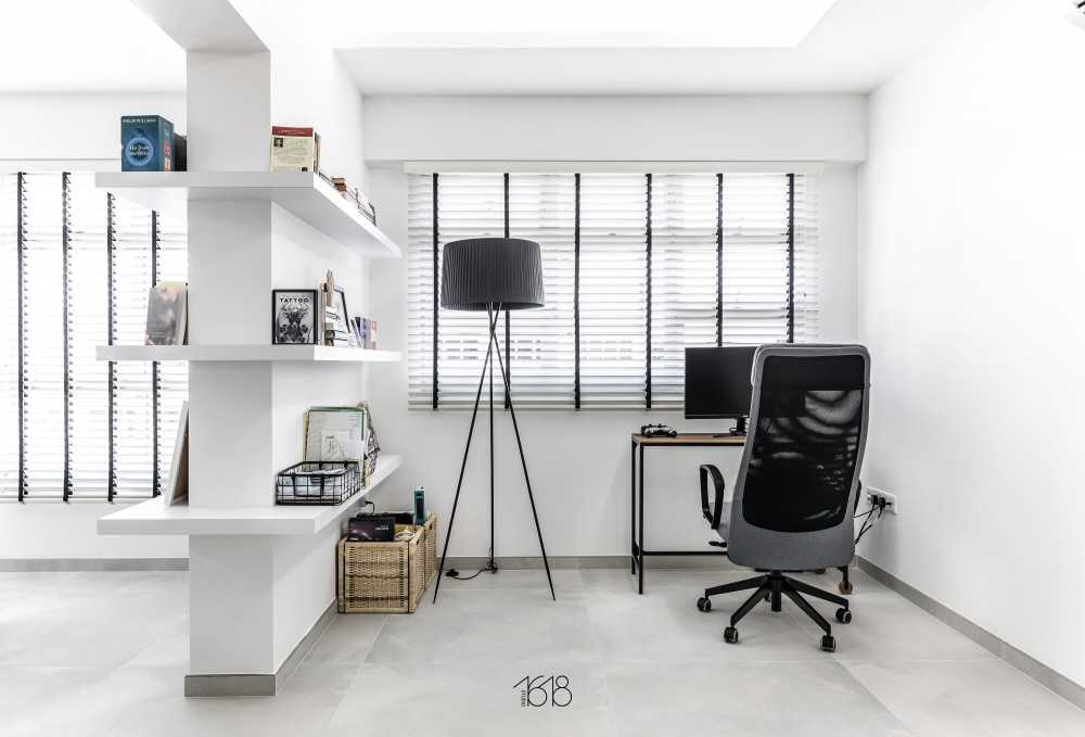 minimalist study with bookshelf and homogeneous tiles