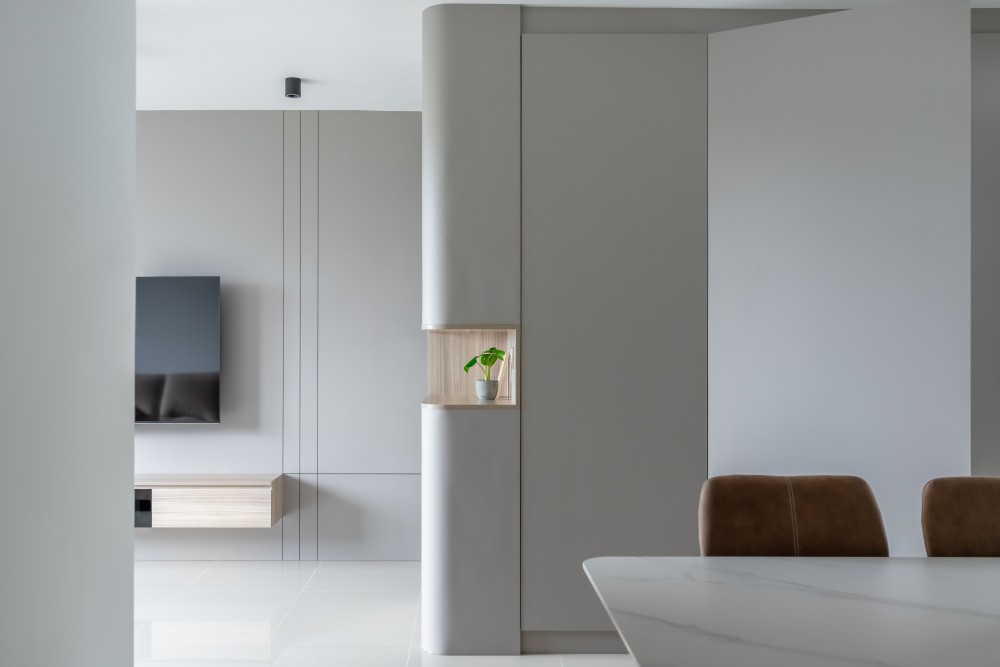 contemporary living room with homogeneous tiles and tv console