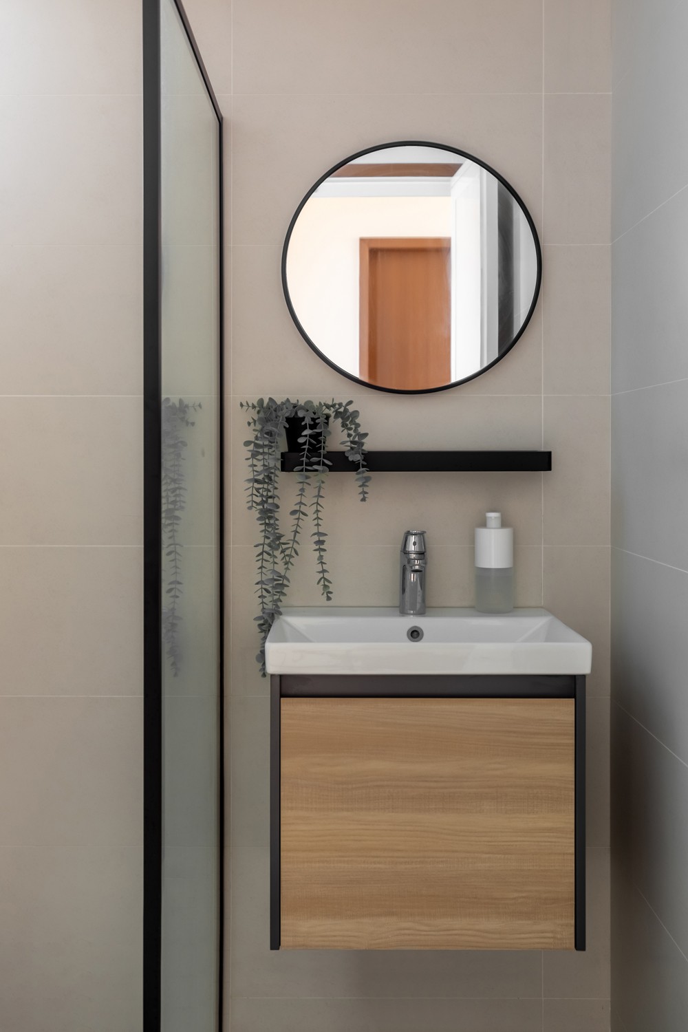 modern bathroom with homogeneous tiles and mirror