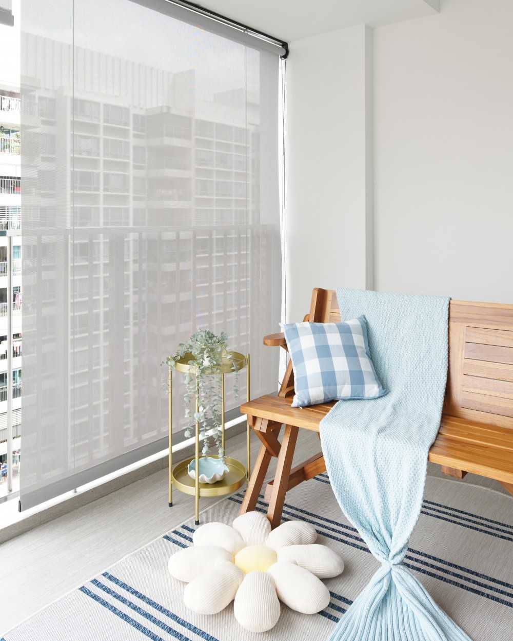 scandinavian balcony with seating bench and blinds