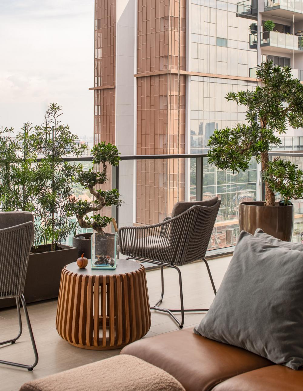 contemporary balcony with outdoor chairs and seating bench