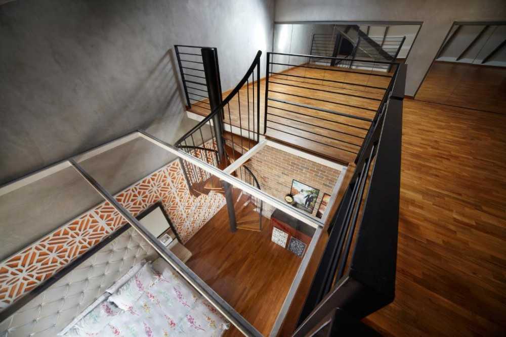 eclectic mezzanine with wood flooring and staircase
