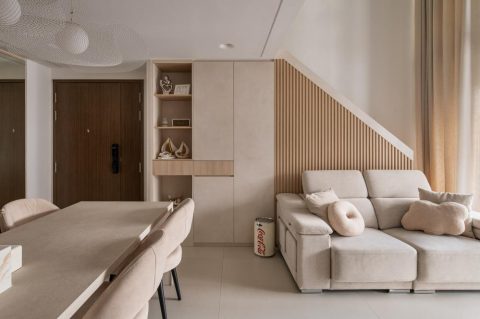 contemporary living room with bookshelf and homogeneous tiles